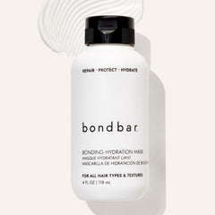 Bondbar jar next to hand for 4 fl oz scale, helps shoppers visualize size