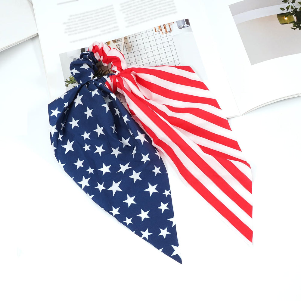 Bookay scrunchies on flag background emphasizing festive holiday style