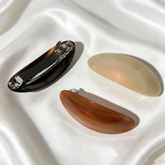 BOUNIQ barrette worn in office setting offering professional polish