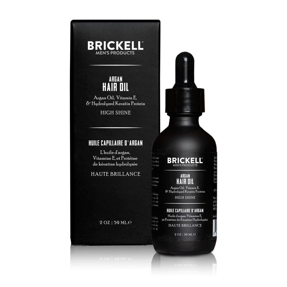 Brickell Men's Product dropper dispensing oil to control amount for styling