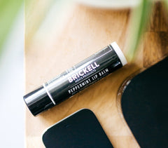 Brickell Men's lip balm close-up texture shot showing smooth, non-greasy formula