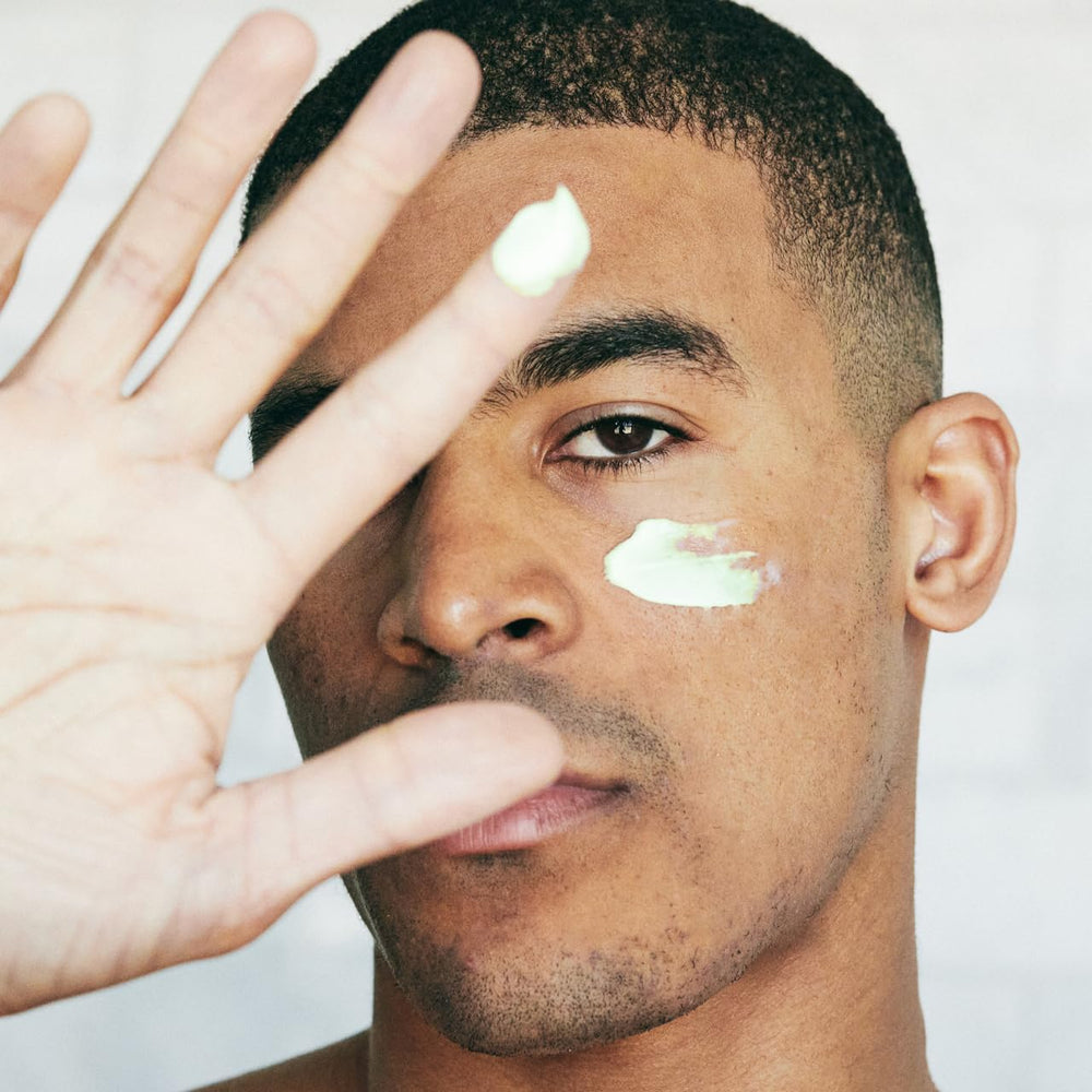 Brickell Men's Products cream on hand showing lightweight spreadability and quick absorption