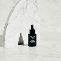 Brickell Men’s Products dropper dispensing serum highlighting precise application