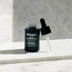 Brickell Men’s Products serum dropper releasing texture for fast-absorption benefit