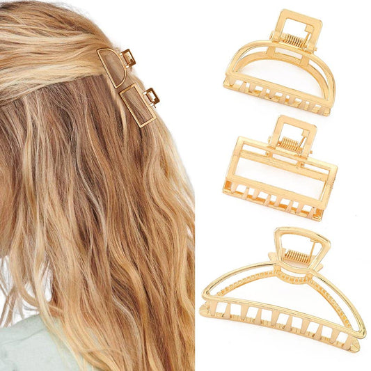 Brinie front view of three gold metal claw clips showing elegant finish and secure hold