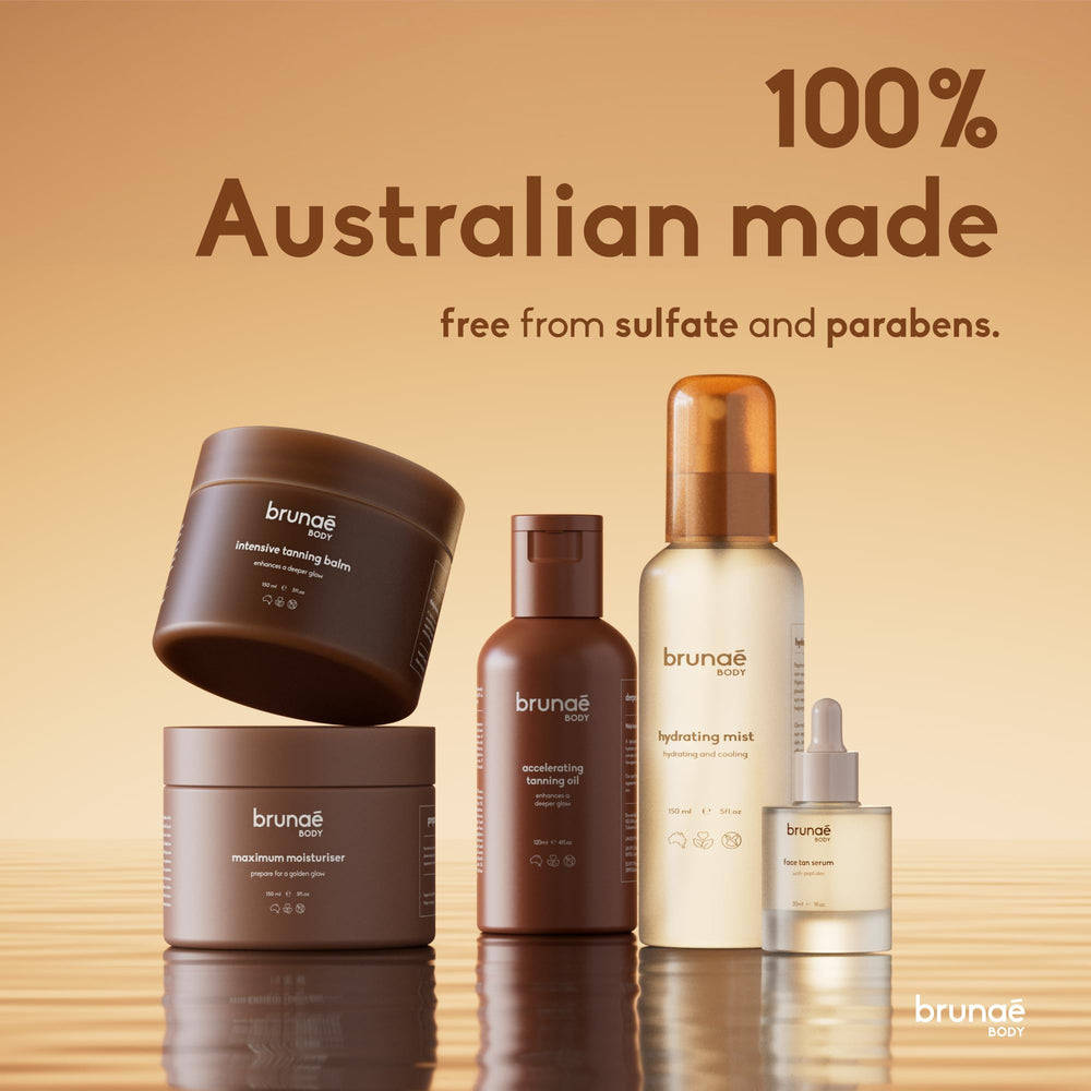 brunae body bottle with ingredients flatlay showcasing jojoba avocado and tamanu oil benefits