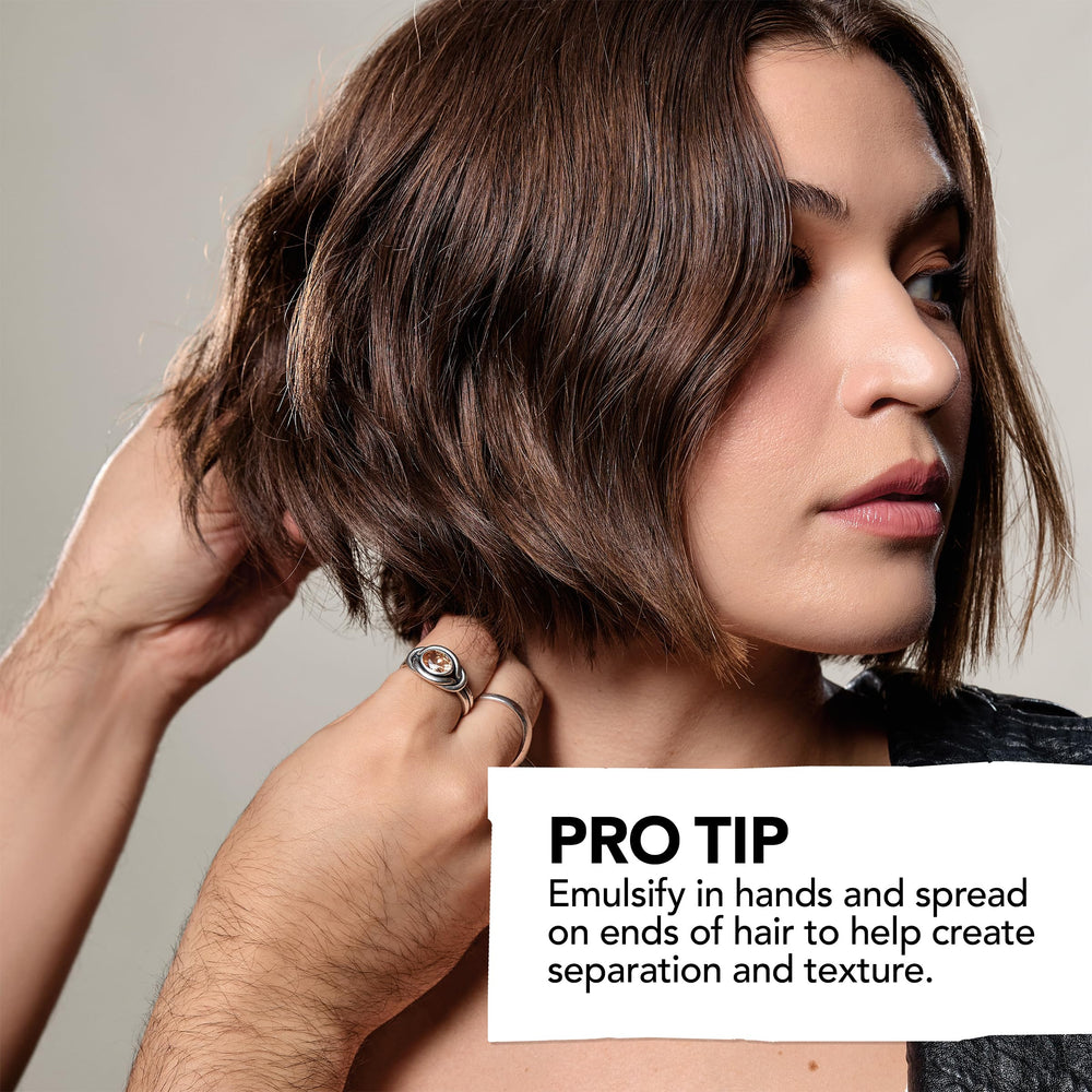Stylist applying Bumble and bumble Sumoclay to short hair for added volume and separation