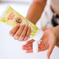 Burt's Bees lotion swatch on skin showing lightweight texture and visible hydration