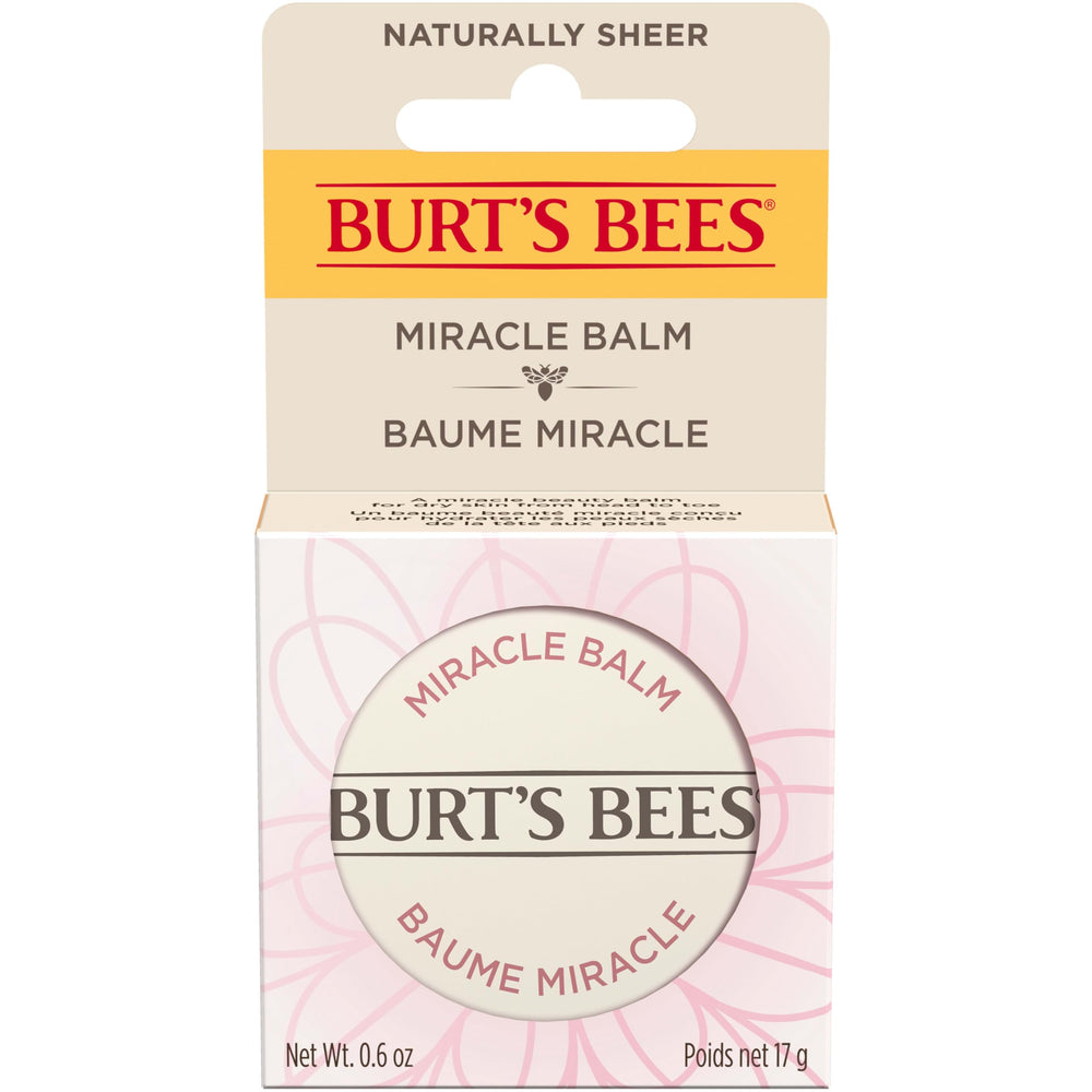 Burt's Bees tin next to a coin showing compact 0.6 oz travel-friendly size