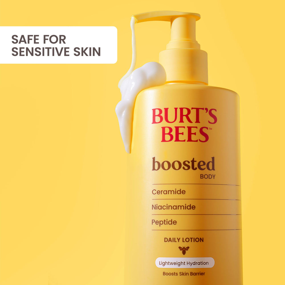 Burt's Bees bottle with guava and melon props to represent tropical fragrance notes