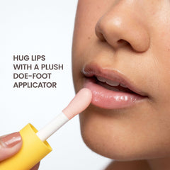 Burt's Bees lip oil in hand for size comparison, portable and travel-friendly convenience