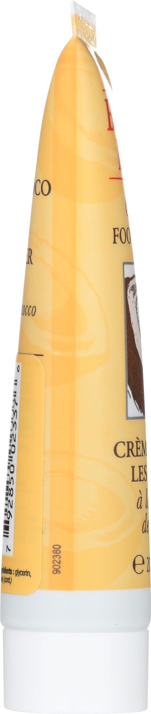 Burt's Bees tube next to keys showing travel-size convenience and readiness
