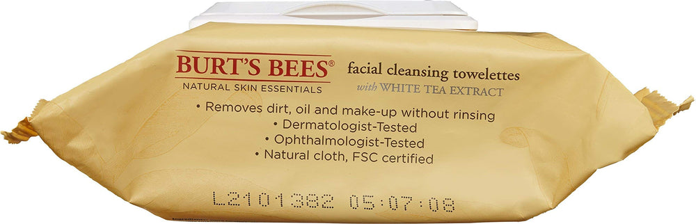 Burt's Bees towlette in hand used to remove makeup demonstrating quick no-rinse benefit
