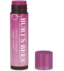 Burt's Bees balms in hand showing size and portability advantage