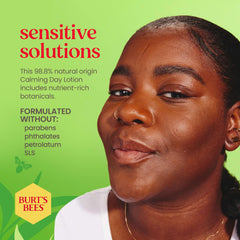 Burt's Bees applying lotion on cheek in mirror demonstrating easy absorption
