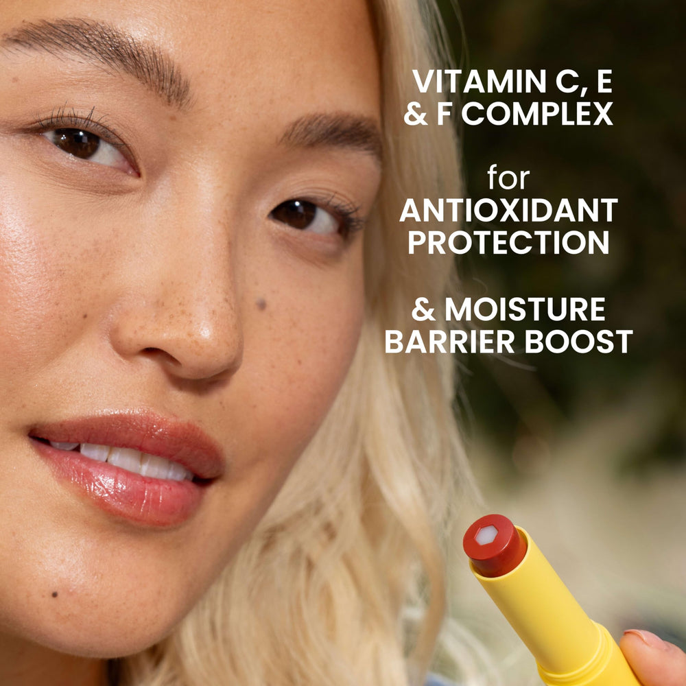 Burt's Bees tube held in hand showing compact size and travel convenience benefit
