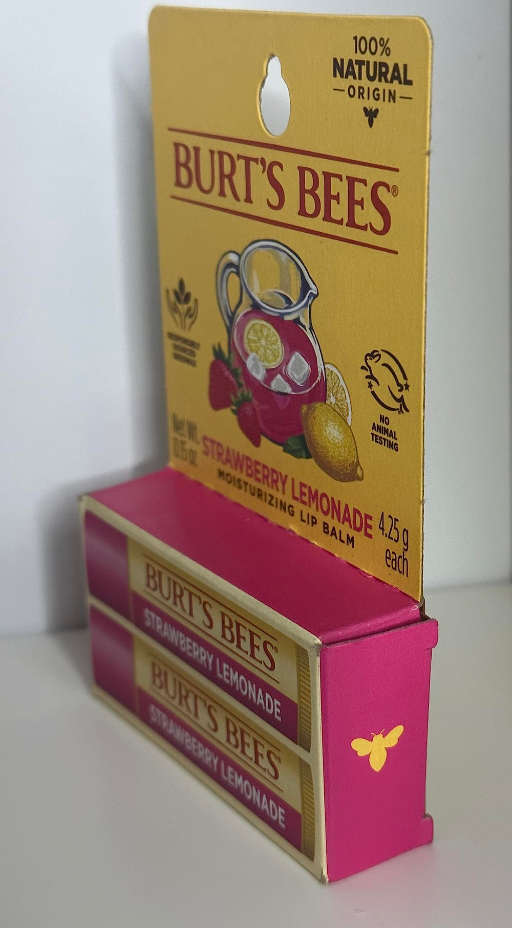 Burt's Bees beeswax and fruit pieces representing natural ingredients for moisturizing