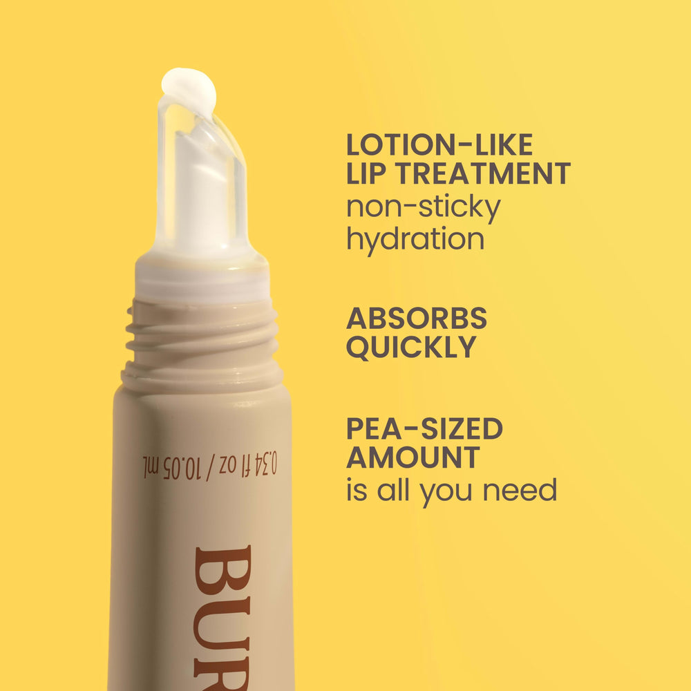 Burt's Bees tube held in hand showing compact travel-friendly size