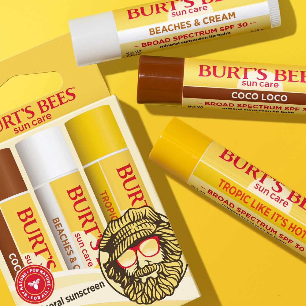Burt's Bees tubes with water splash showing water-resistant protection for active days