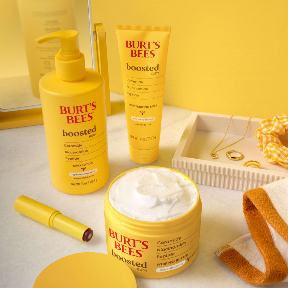 Burt's Bees jar next to a hand for scale showing the 6.5 oz size convenience