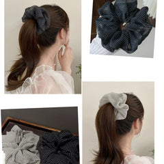 CAFUDEYE scrunchie beside coin and brush to show true size and scale