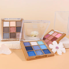 CAKAILA palette beside a hand to show compact travel size and portability