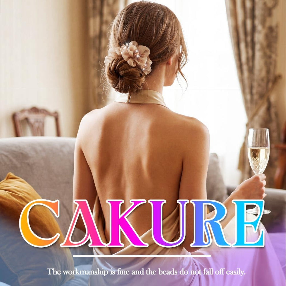 CAKURE scrunchie on hand for size comparison and styling guidance
