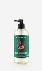 Caldrea front bottle of Orange Blossom Bamboo hand soap showing label and scent benefit