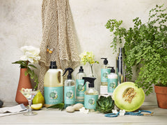 Caldrea bottle staged in bathroom for a fresh, spa-like atmosphere