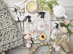 Caldrea Sweet Pea bottle beside delicate linen showing safe use for hand-wash fabrics