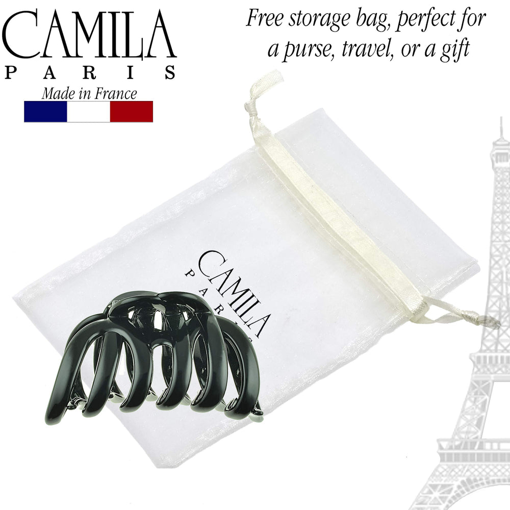 Camila Paris next to hand for size comparison and easy portability