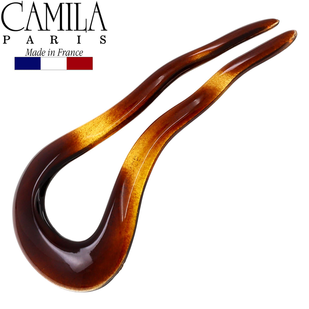 Camila Paris in-use securing a chignon bun for all-day hold benefit