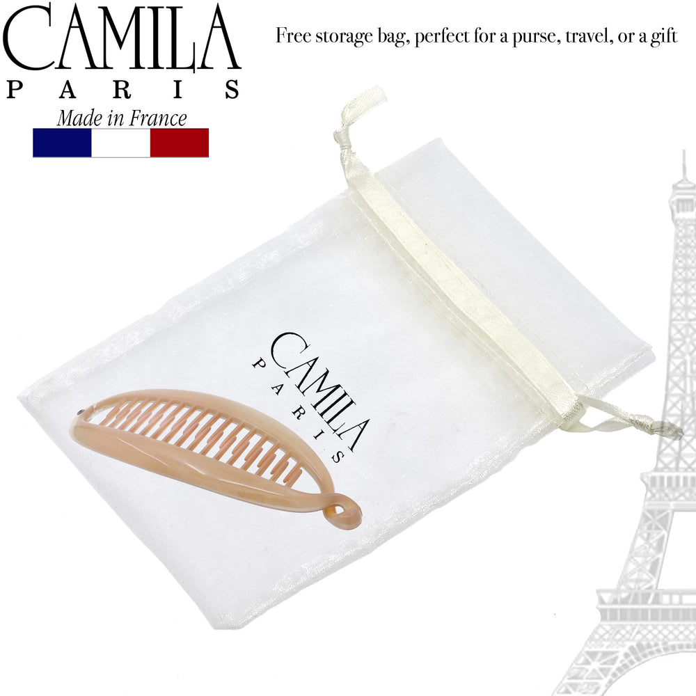 Camila Paris clip in hand for scale illustrating compact travel convenience