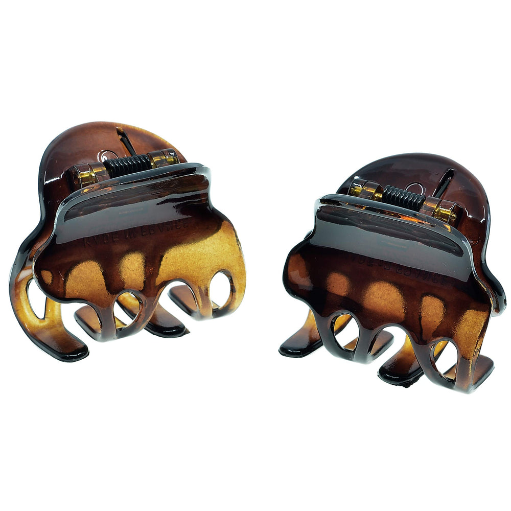 Camila Paris front packaging showing two tortoise clips and brand label, durable finish benefit