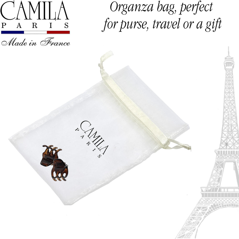 Camila Paris holding a mini bun on model showing compact, reliable control