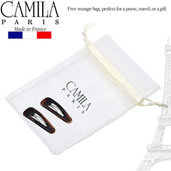 Camila Paris clip beside hand for scale showing compact 2.5-inch size