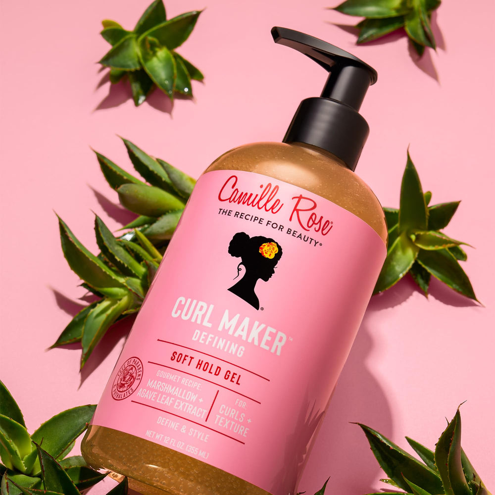 Camille Rose product in hand being applied to wet hair to demonstrate easy distribution