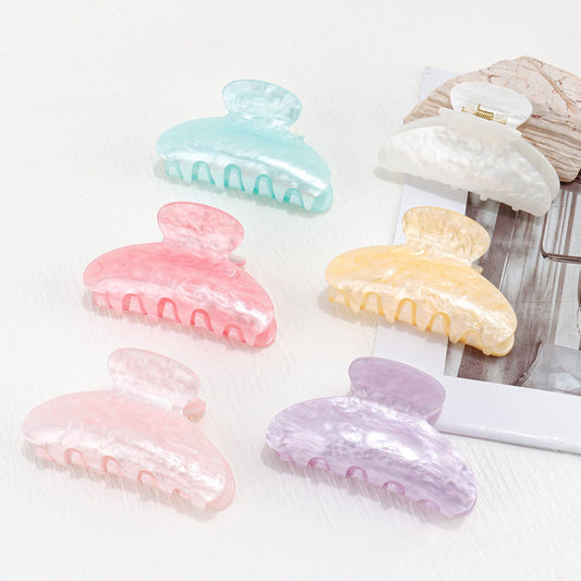 Canitor front view of marbled acrylic clip showing stylish finish and secure hold