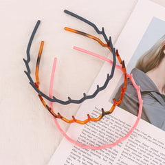 Canitor headband styled with a bun illustrating neat, finished look