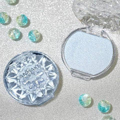 CANMAKE Munyutto beside coin showing compact size and travel-friendly convenience benefit