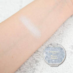 CANMAKE swatch on forearm showing Blue Topaz dewy sheen
