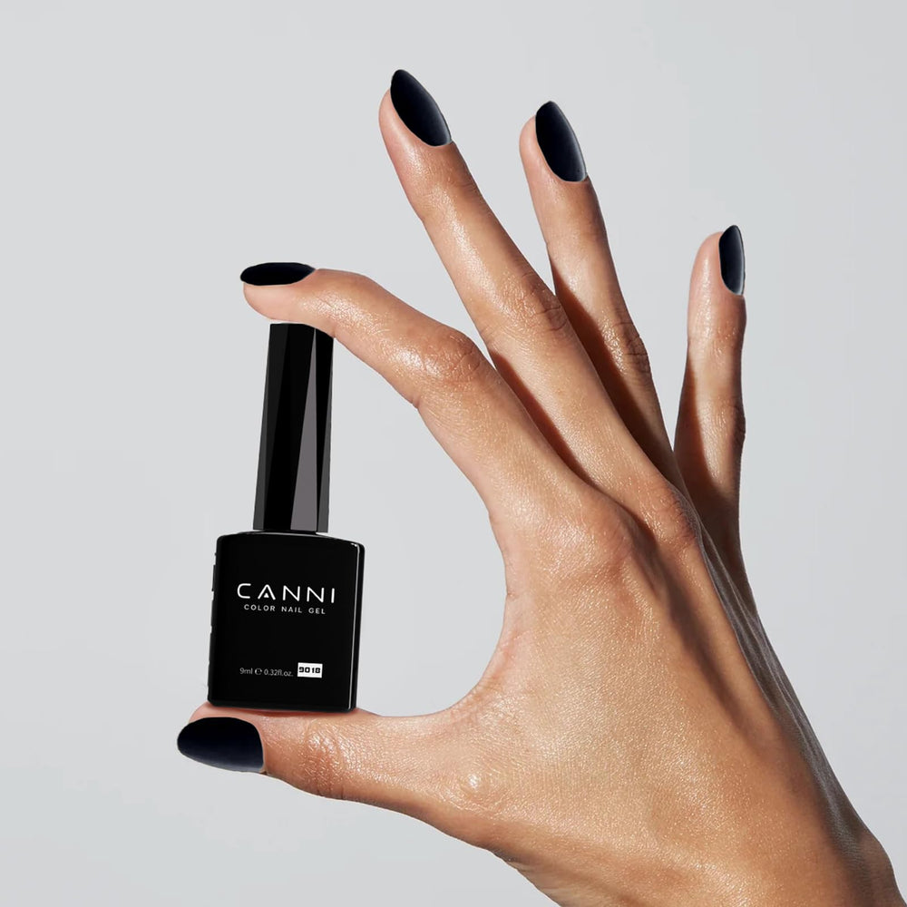CANNI bottle held in hand for size and scale, easy to store and travel