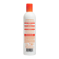 Cantu daily oil moisturizer pump application on hands demonstrating controlled dispense and smooth finish