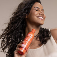 Model with defined curls after Cantu use showing enhanced curl pattern