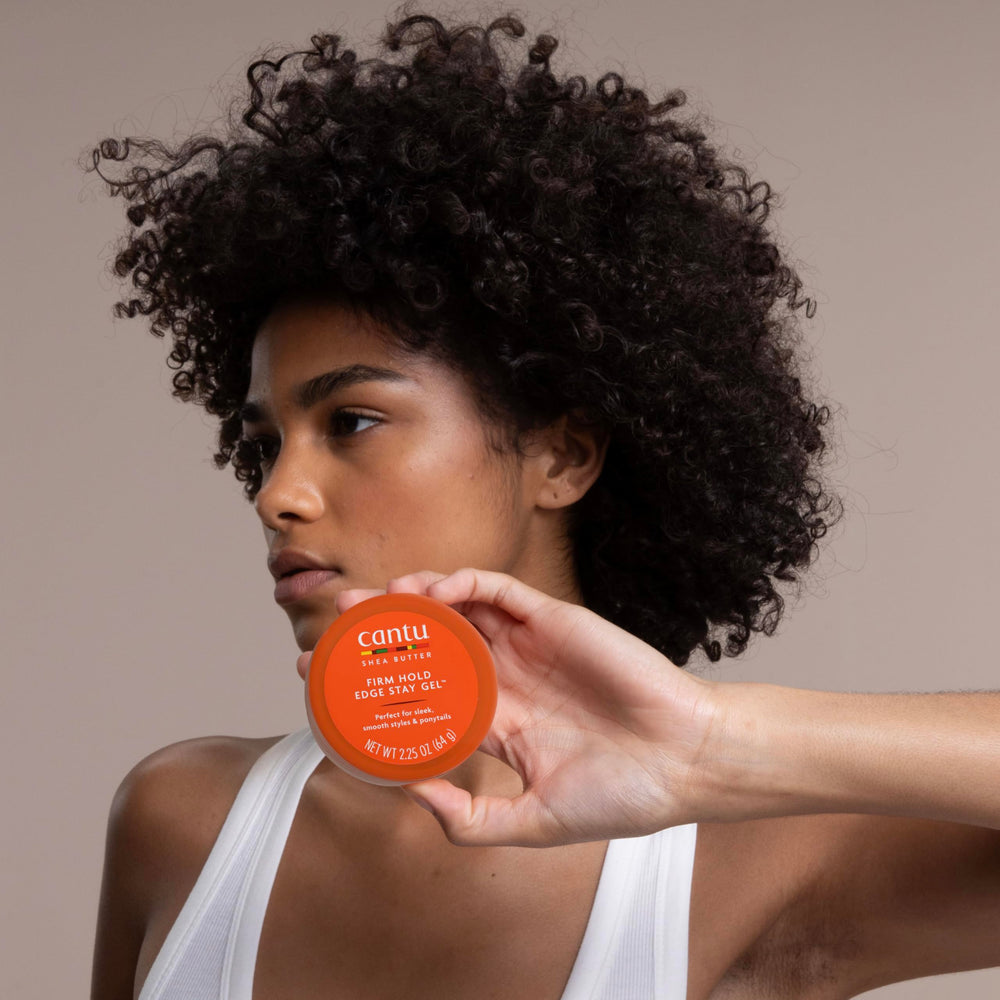 Application on fingertips showing Cantu gel easy spread for precise styling