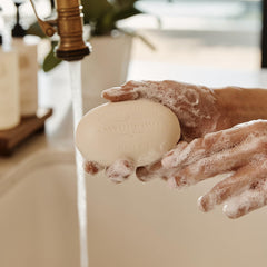 Close-up of Caswell-Massey soap label showing scent notes and craftsmanship