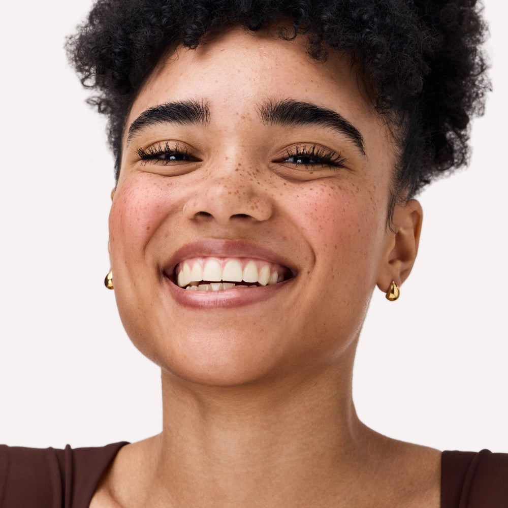 Catrice blush applied to model cheeks giving natural lifted glow and warmth