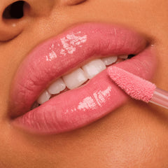 Catrice layered over lipstick showing intensified shine and finishing touch benefit
