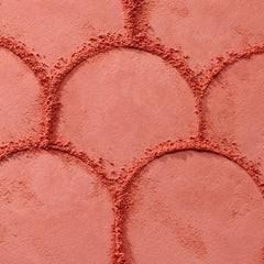Catrice blush being picked up by brush demonstrating easy pick-up and blend