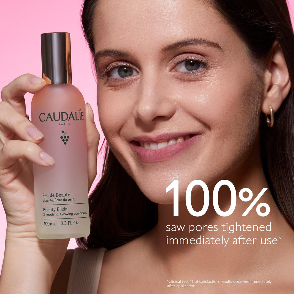 Caudalie 100 mL bottle held in hand to display travel-friendly scale
